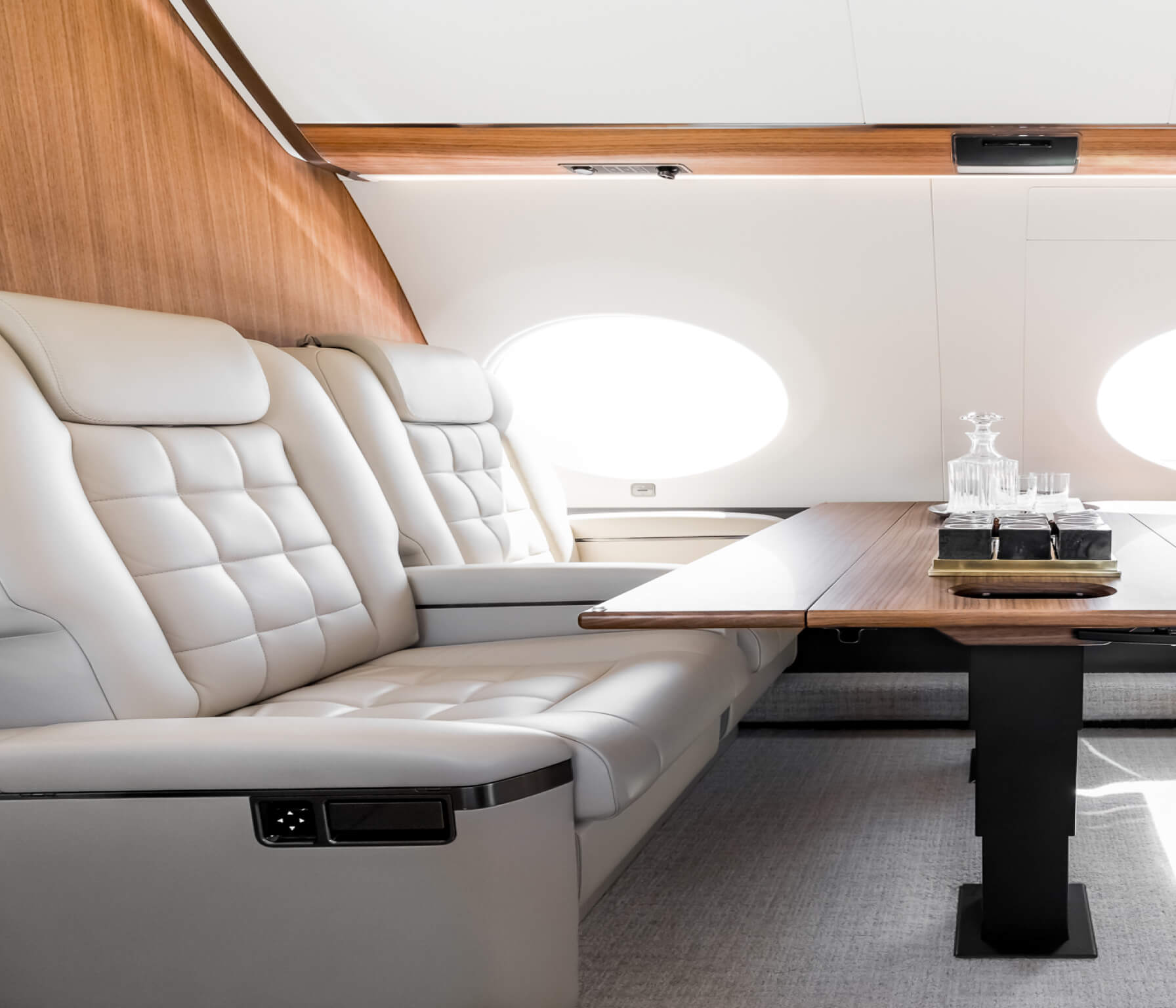 Interior of a private jet showing 4 empty seats