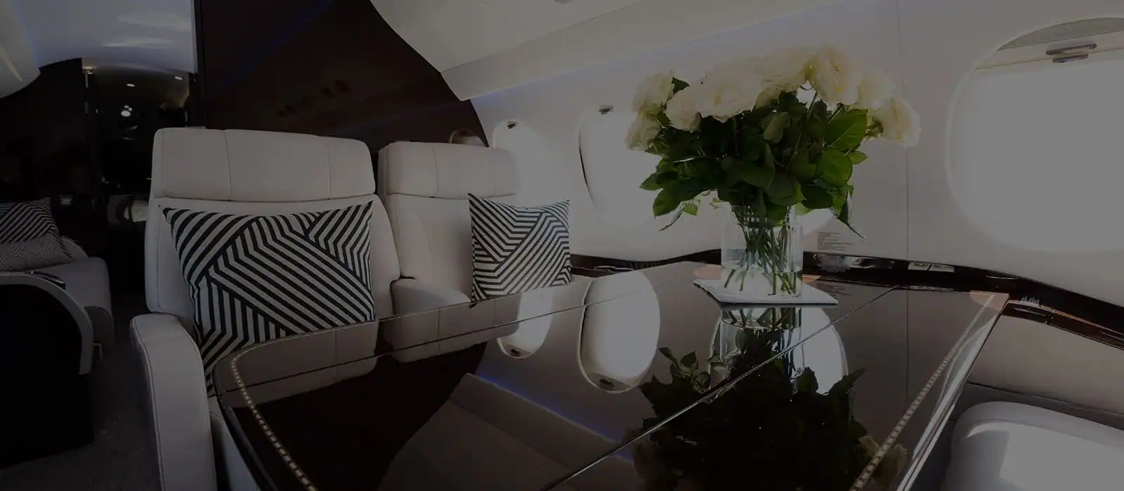 Luxury dinner table set inside an airplane cabin