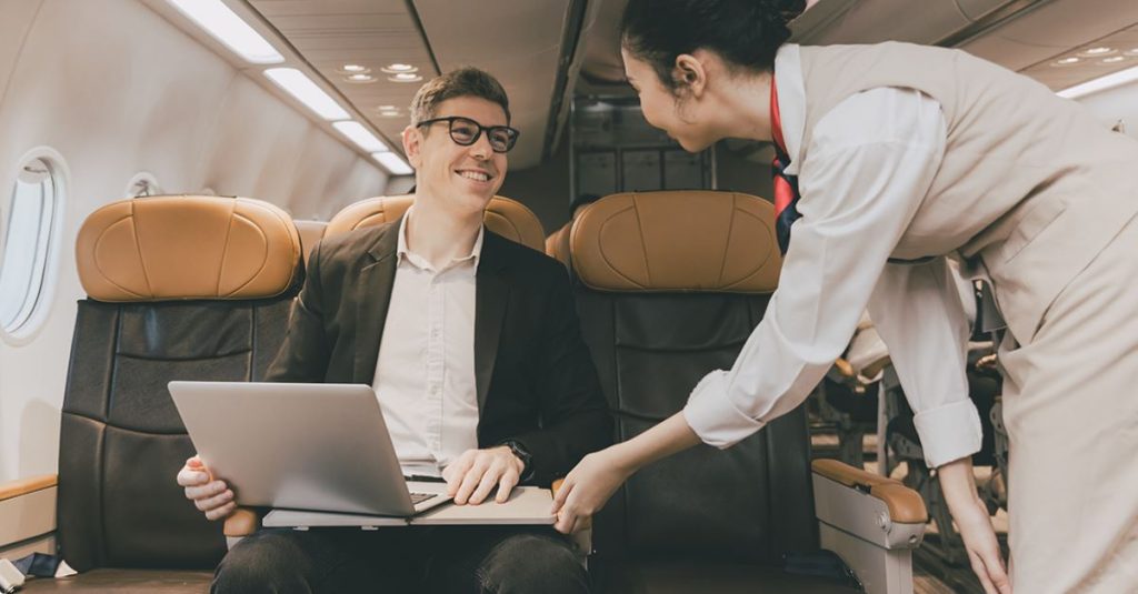 private jet passenger with a laptop