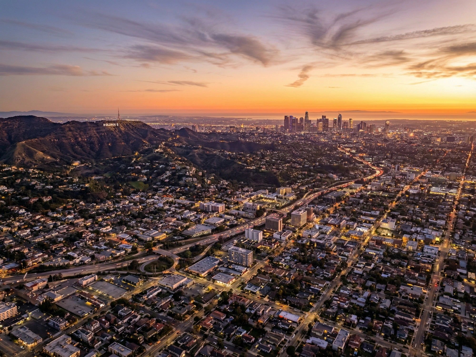 Panoramic aerial view of Los Angeles skyline at golden hour
