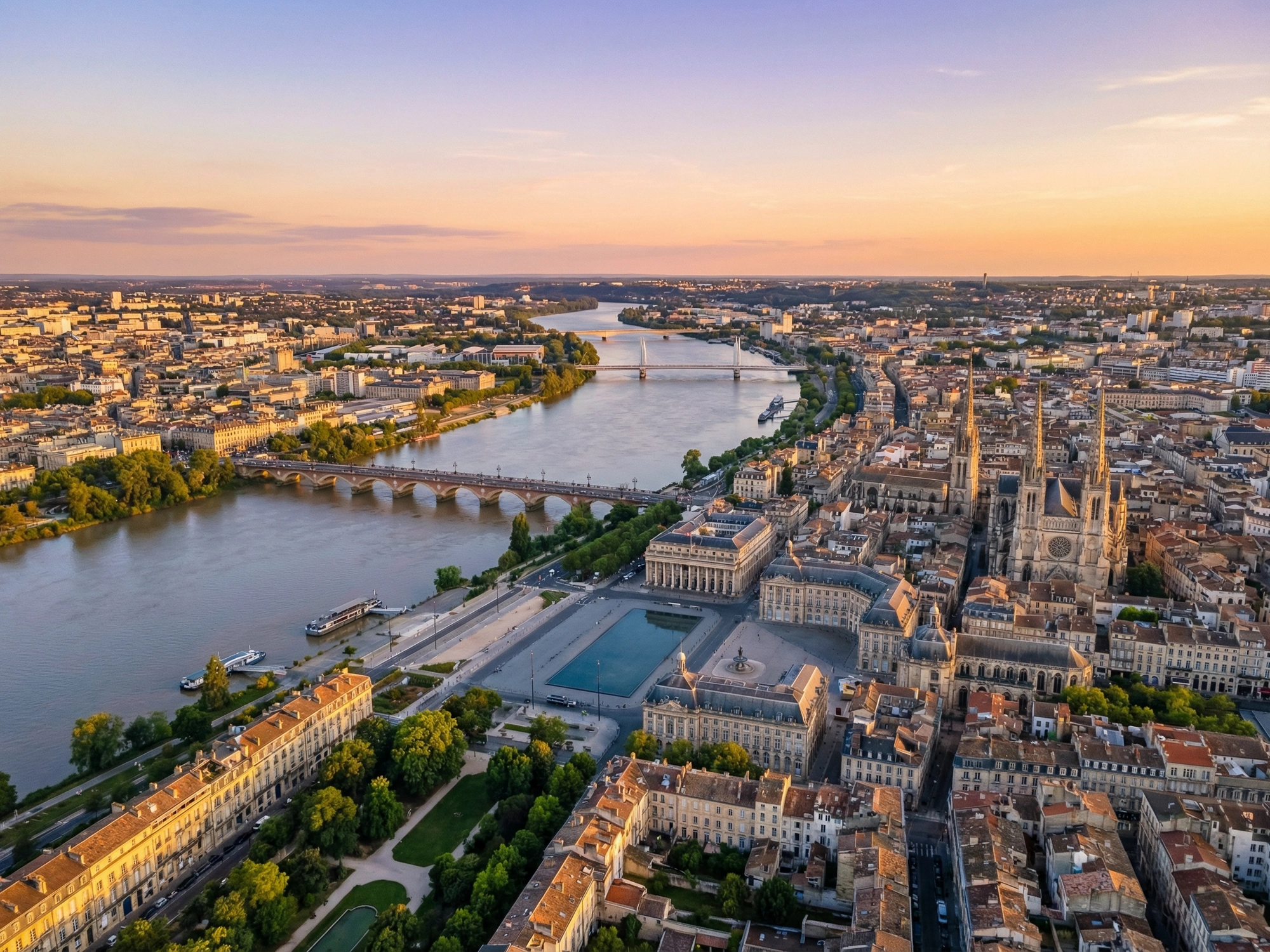 Panoramic aerial view of Bordeaux skyline at golden hour
