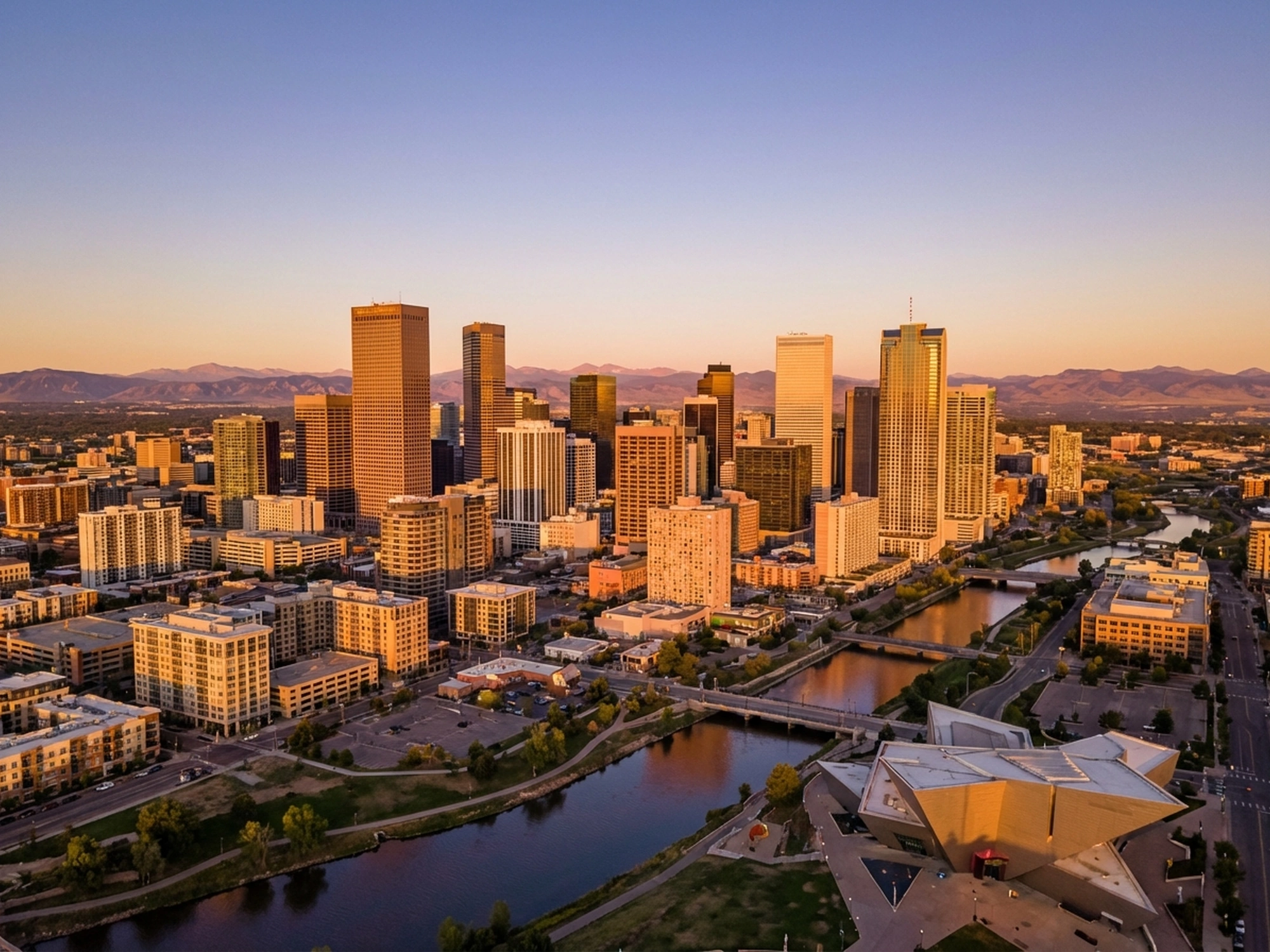 Panoramic aerial view of Denver skyline at golden hour
