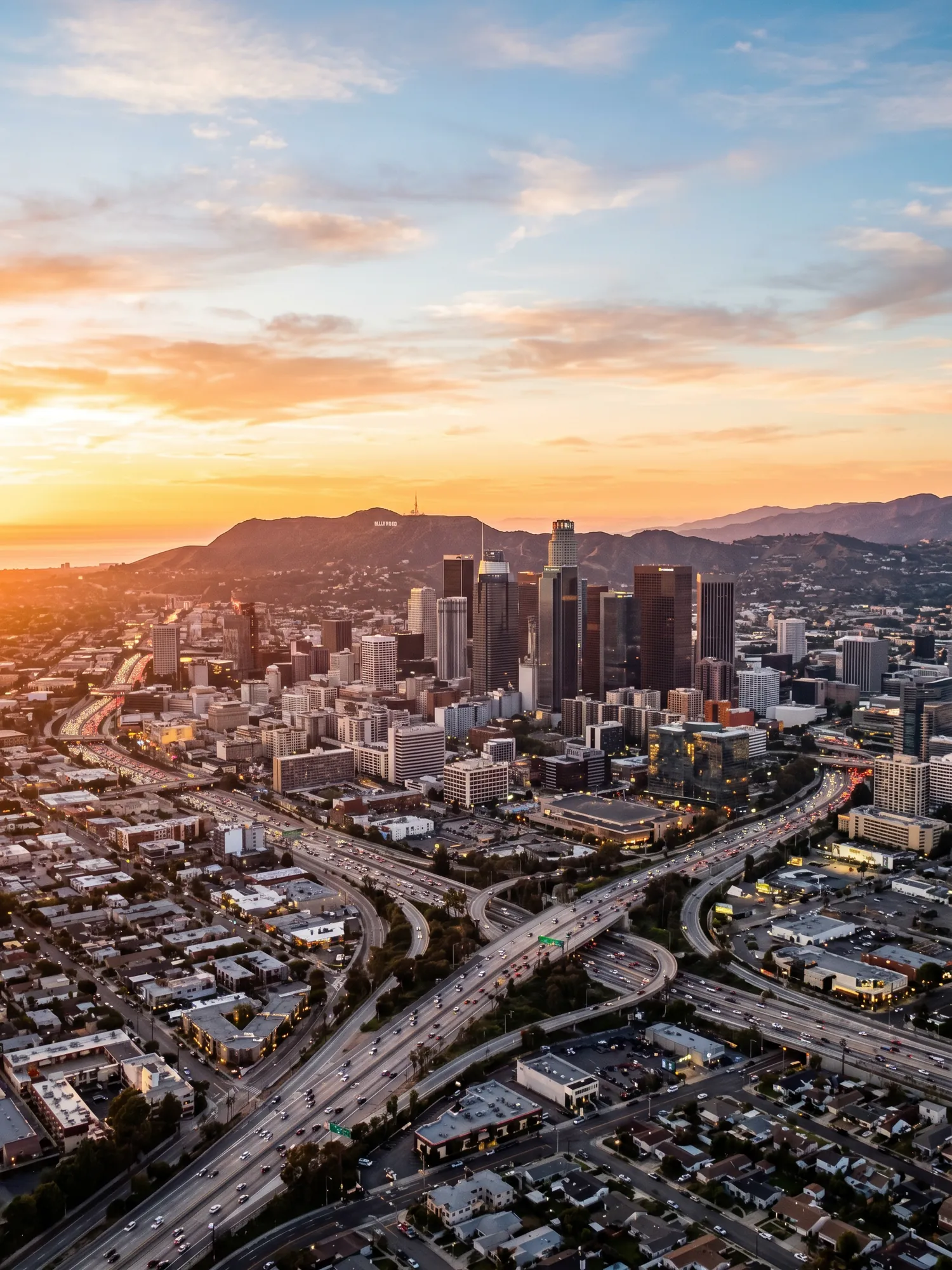 Panoramic aerial view of Los Angeles skyline at golden hour