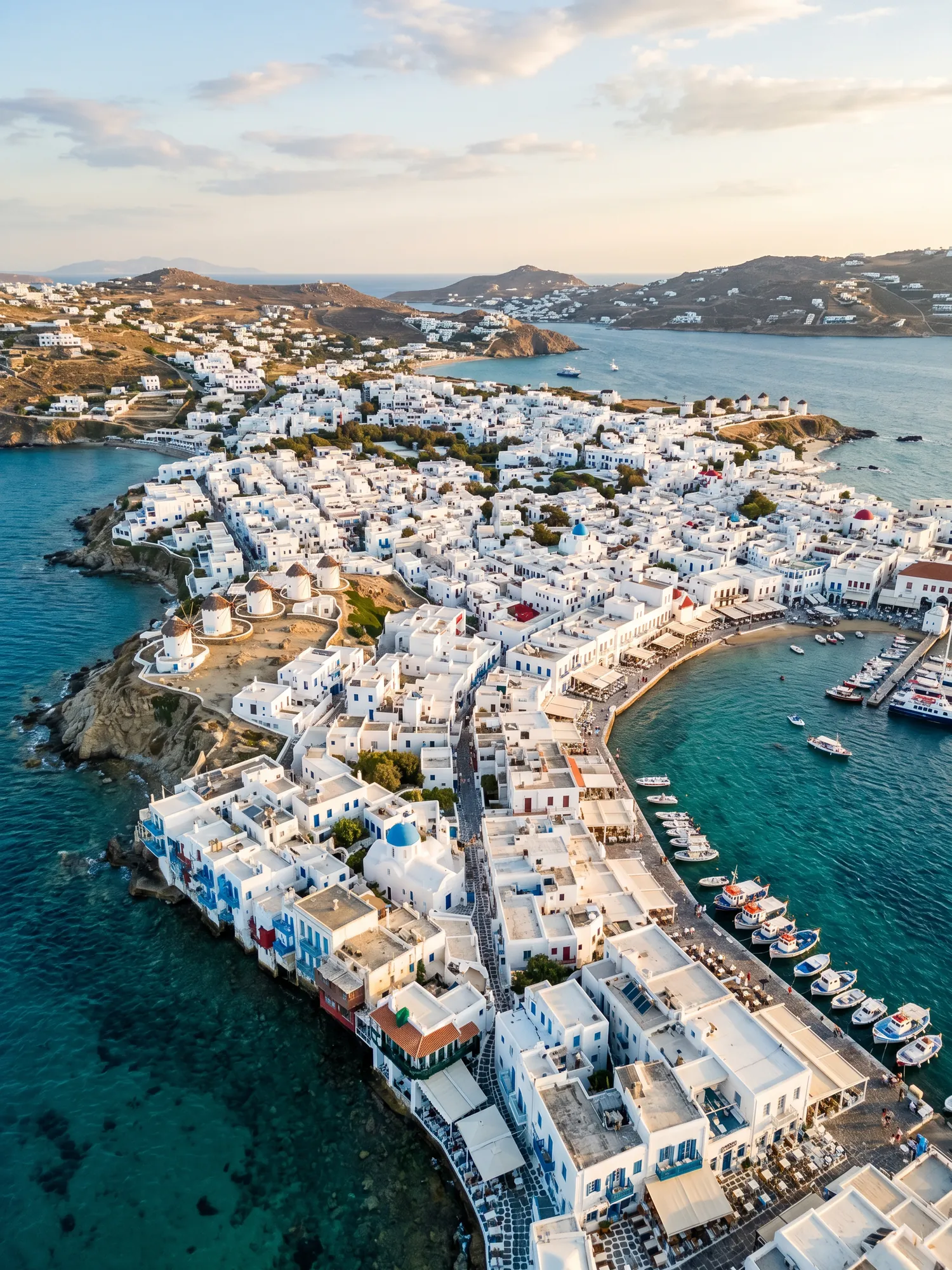 Panoramic aerial view of Mykonos skyline at golden hour