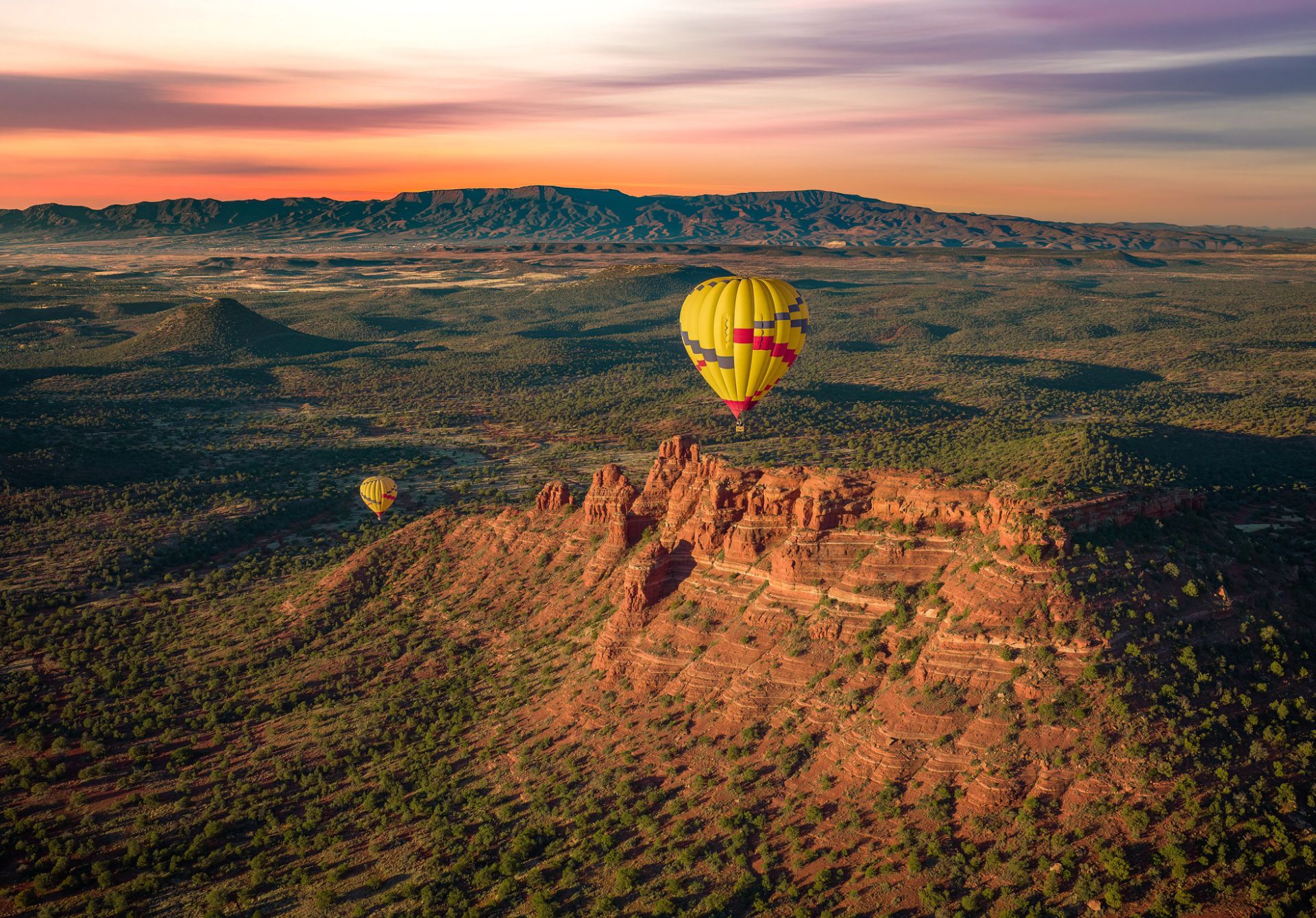 Image of Hot Air Balloons Above Sedonas Red Rocks At Sunset