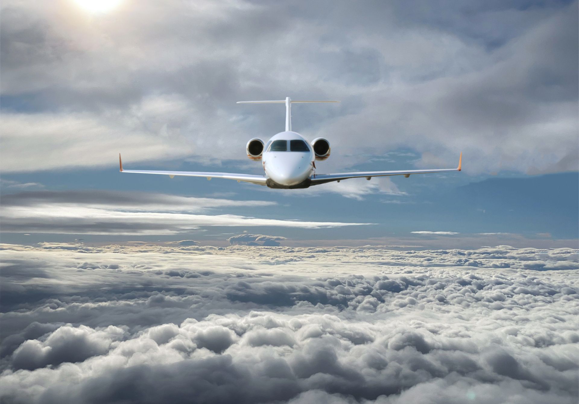 Image of Private Jet Cruising Above The Clouds On A Seamless Luxury Journey