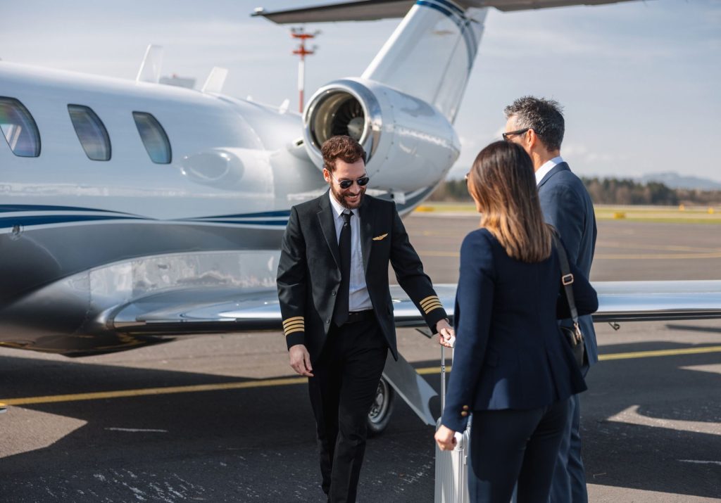 Private jet passengers boarding an aircraft
